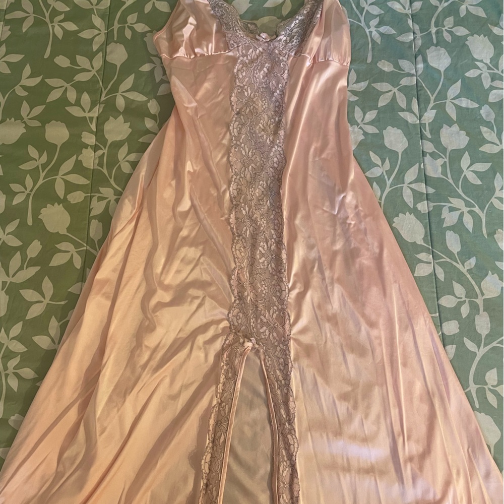 A long satin rose pink lingerie slip with a long slit down the middle.